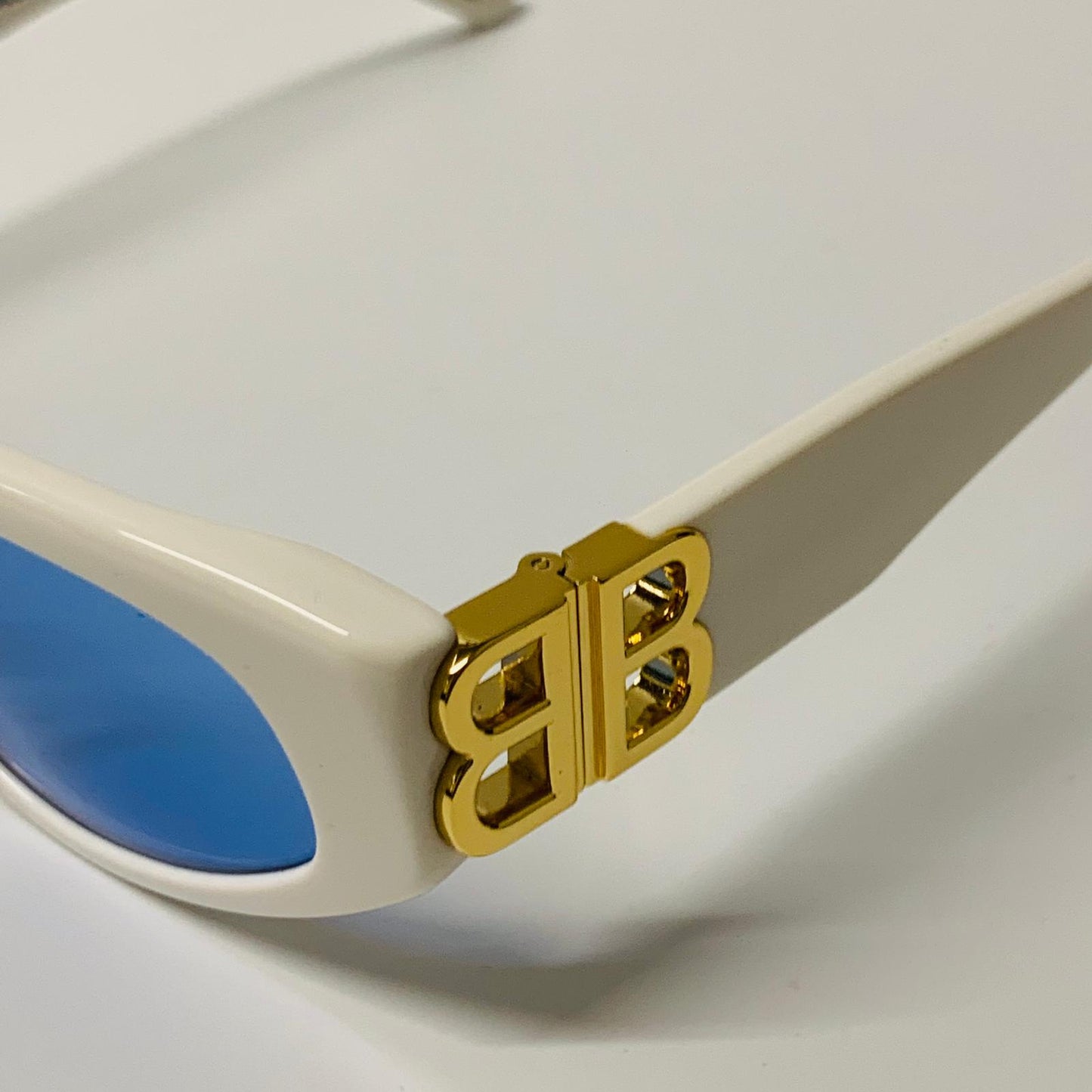 BALENCIAGA Gold Ladies Cat Eye Sunglasses White Blue Lens Gold Logo NEW